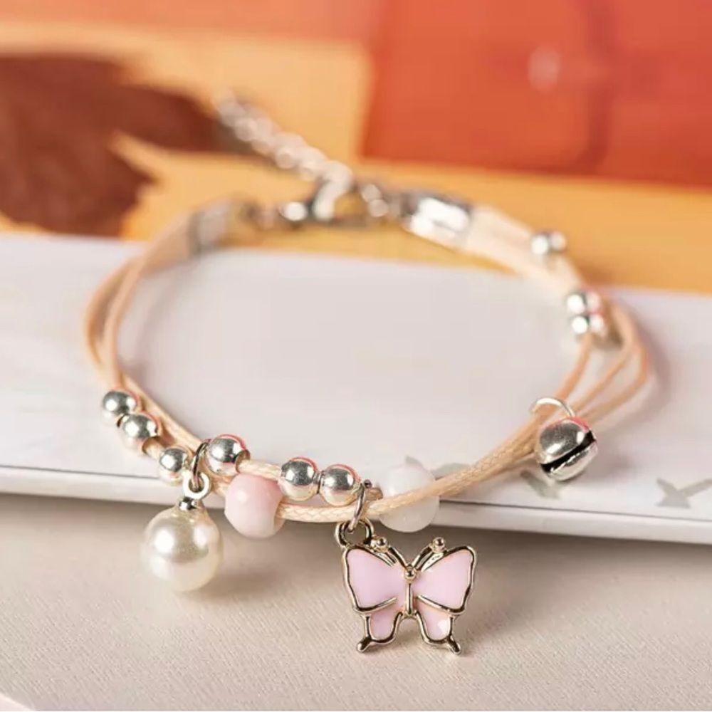 2 ADJUSTABLE BEADED, GLAZED CHARM, CORDED BRACELETS‎
